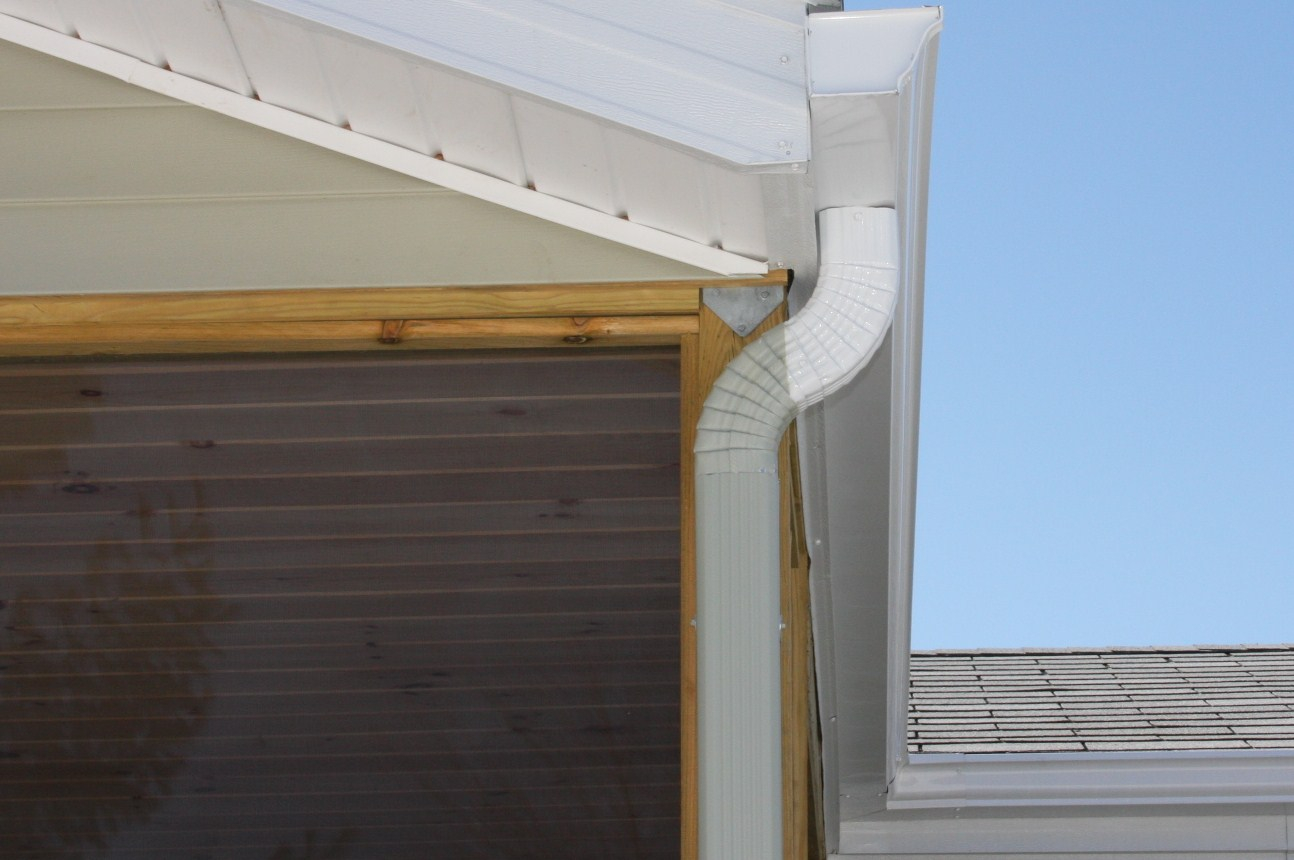 Seamless Gutters Running Down Residential Garage